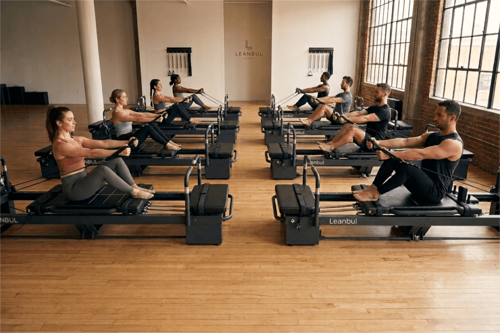 Professional Pilates studio with multiple commercial reformers